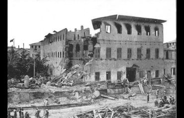 Close-up view of a multi-story stone building in Zanzibar partially destroyed by shellfire after the shortest war in history